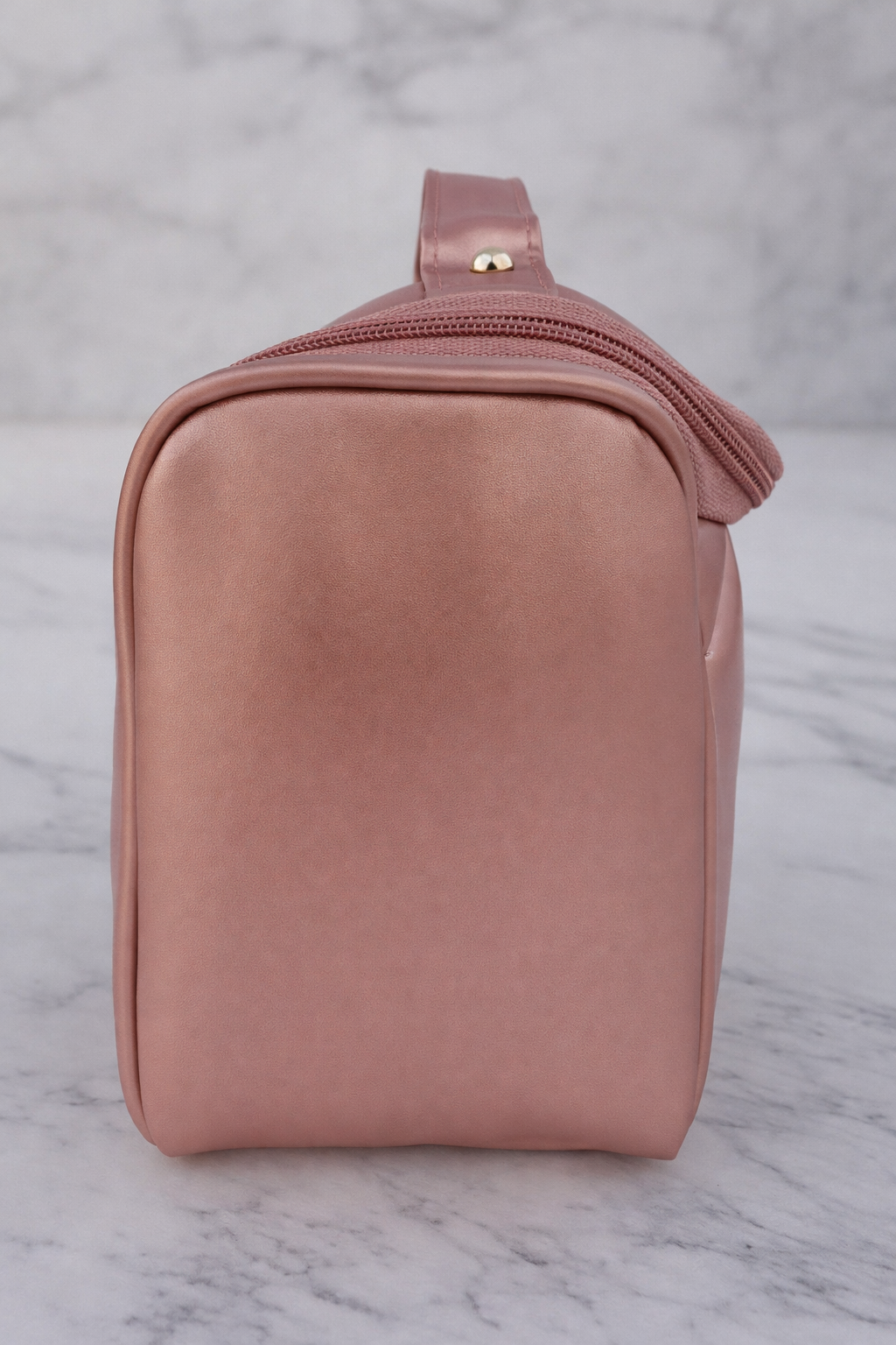 Rose gold quilted beauty case, front view
