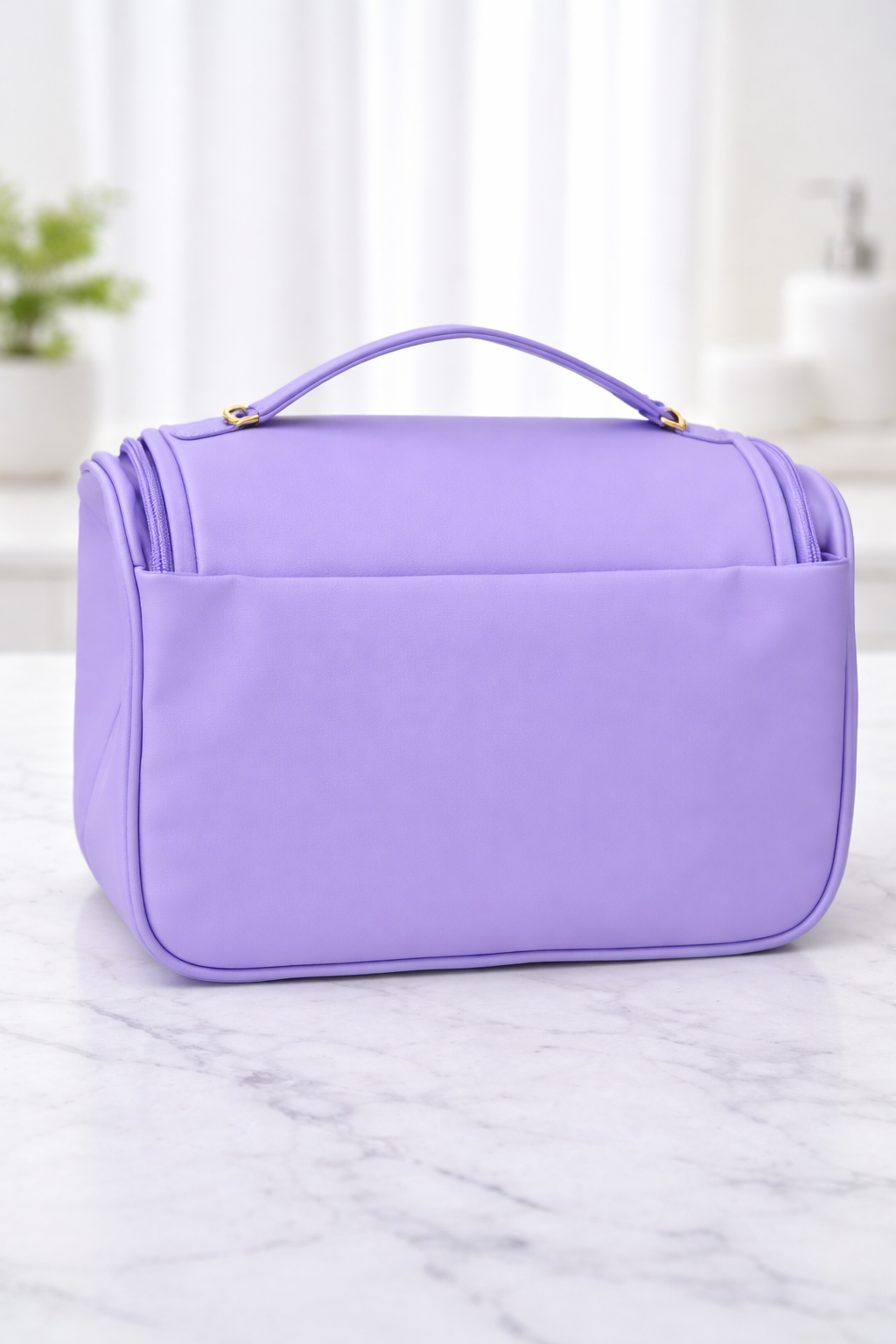 Lavender quilted beauty case on a marble surface