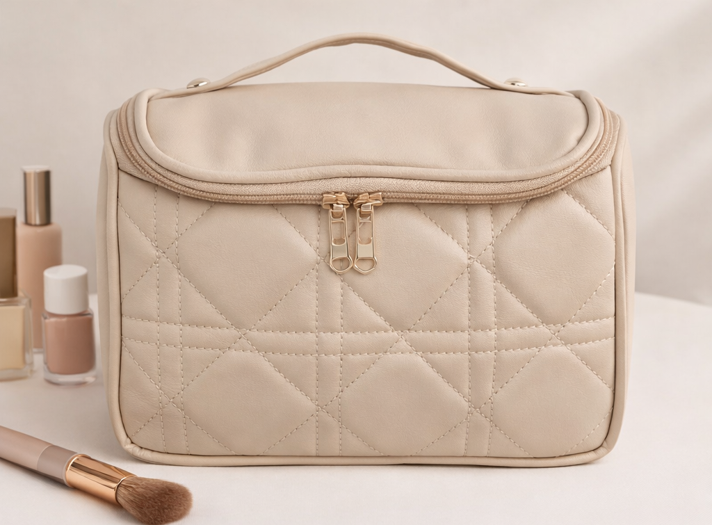 Beige quilted beauty case, three-quarter front view on a light background