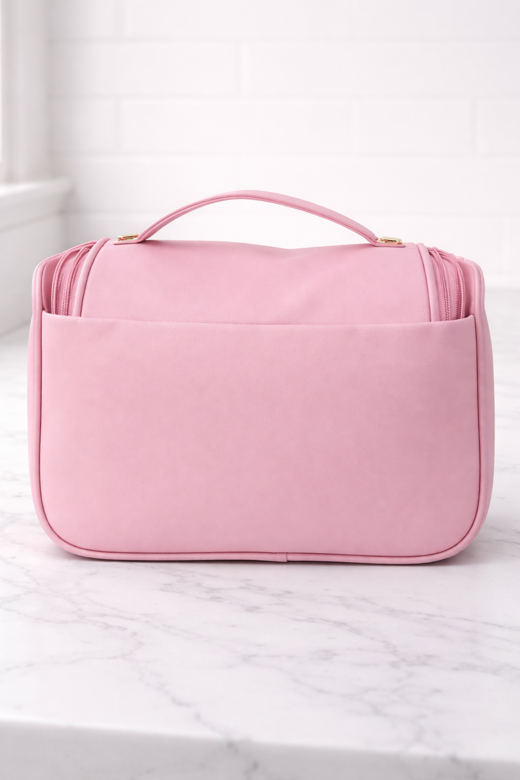 Pink quilted beauty case, front view